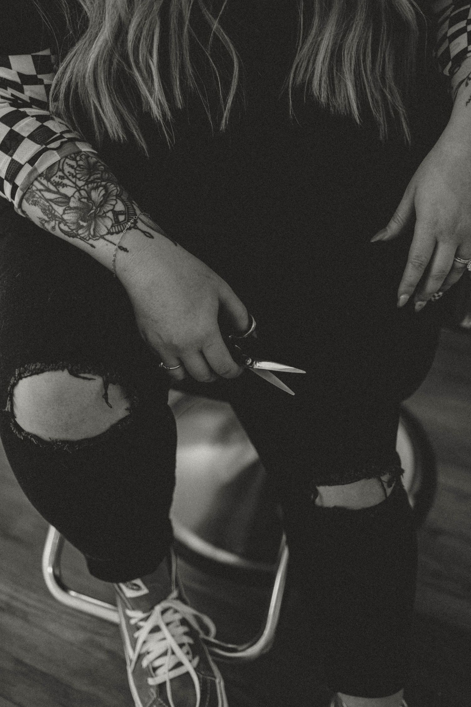 Close-up black and white photos show someone lacing up white athletic sneakers with black accents.