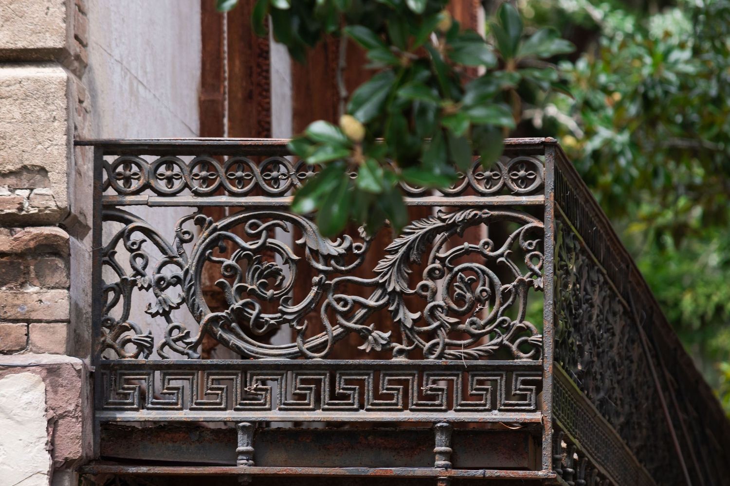 Ornate wrought iron balcony in downtown savannah, historic savannah