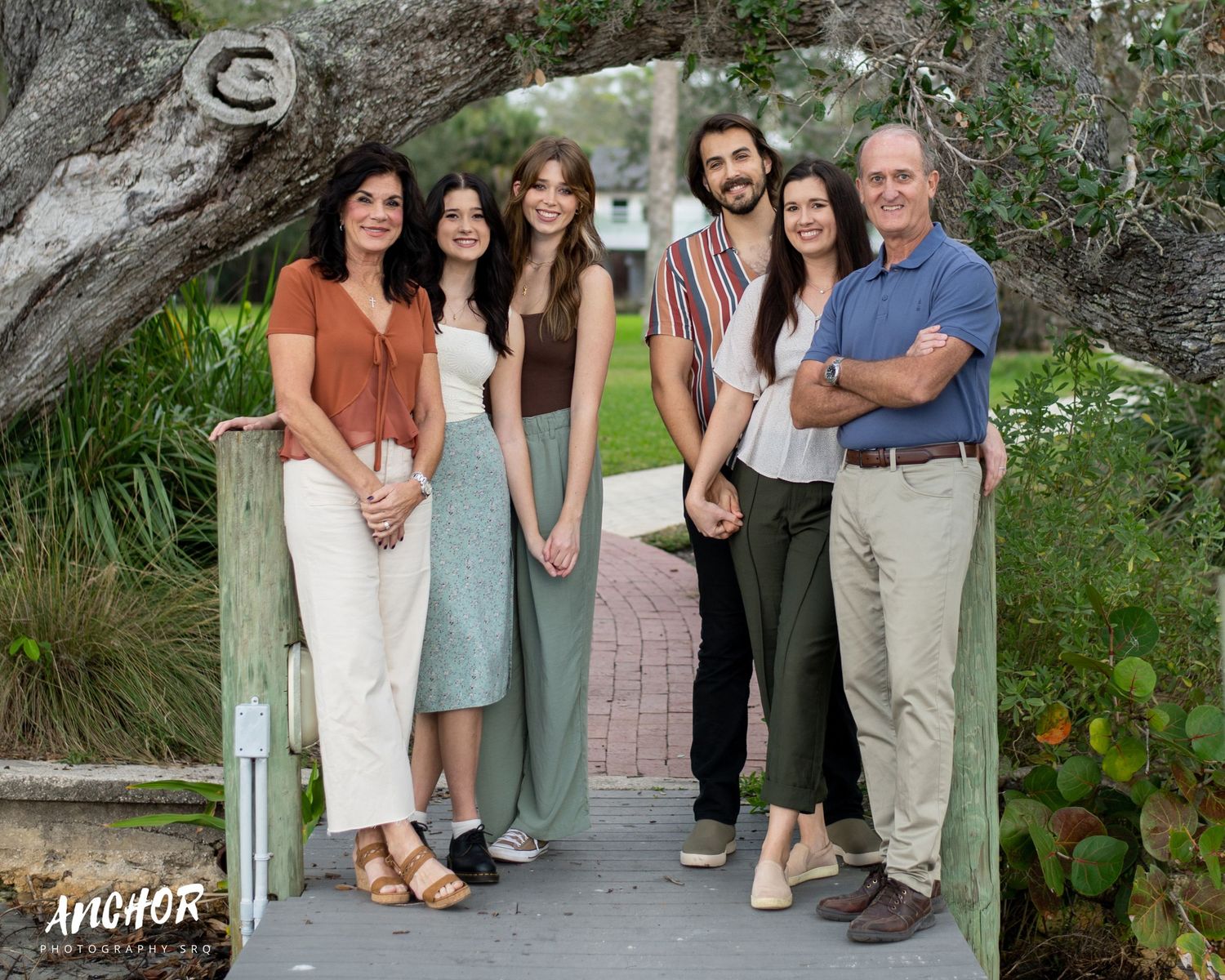 Family standing on a dock