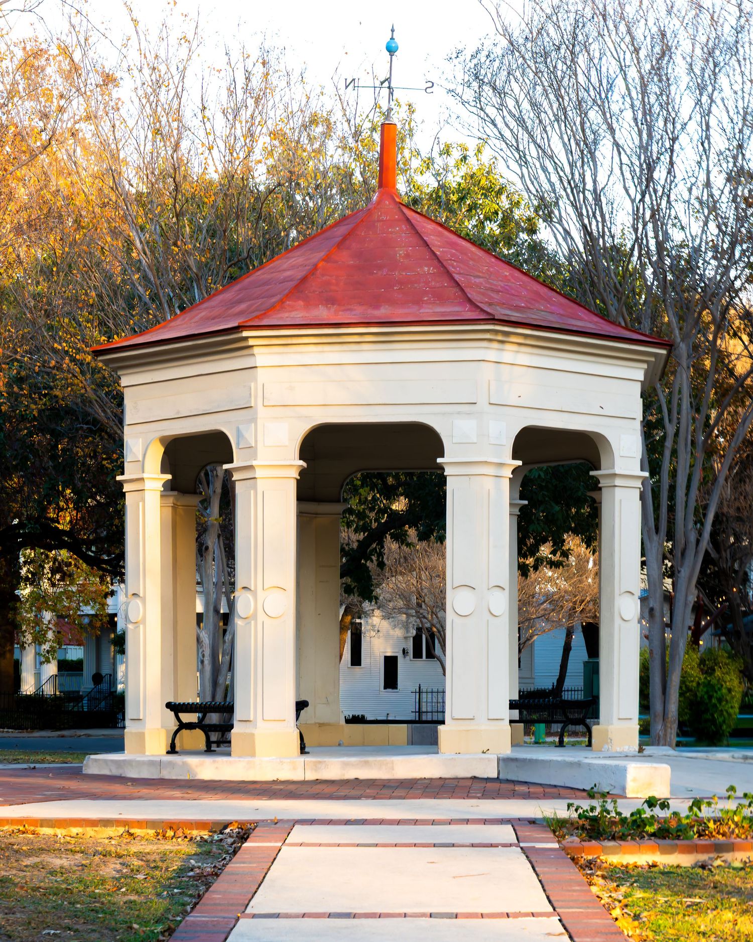 Wedding ceremony at gazebo in San Antonio with officiant and photographer.