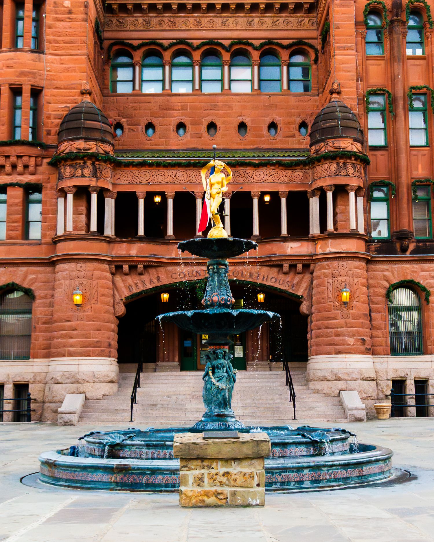 Wedding ceremony at Bexar County Courthouse in San Antonio with officiant and photographer.