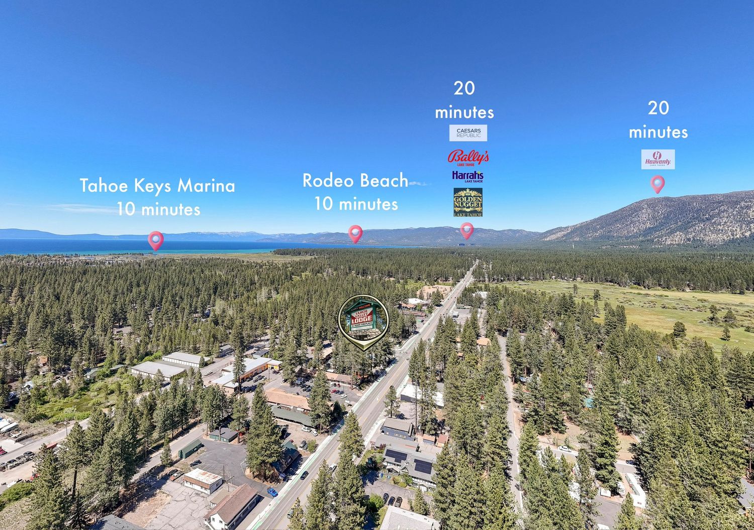 Aerial view of South Lake Tahoe neighborhood near Rodeo Beach and Tahoe Keys Marina, surrounded by pine forests with lake views.