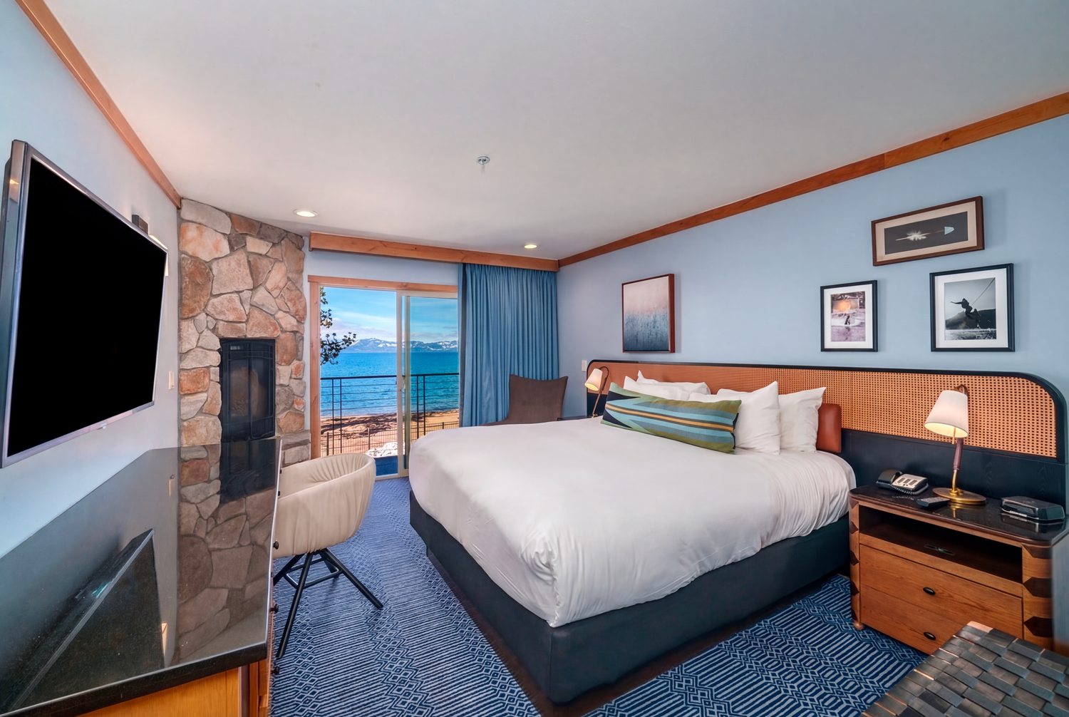 Modern hotel rooms featuring comfortable beds, sleek furnishings and large windows with scenic views.