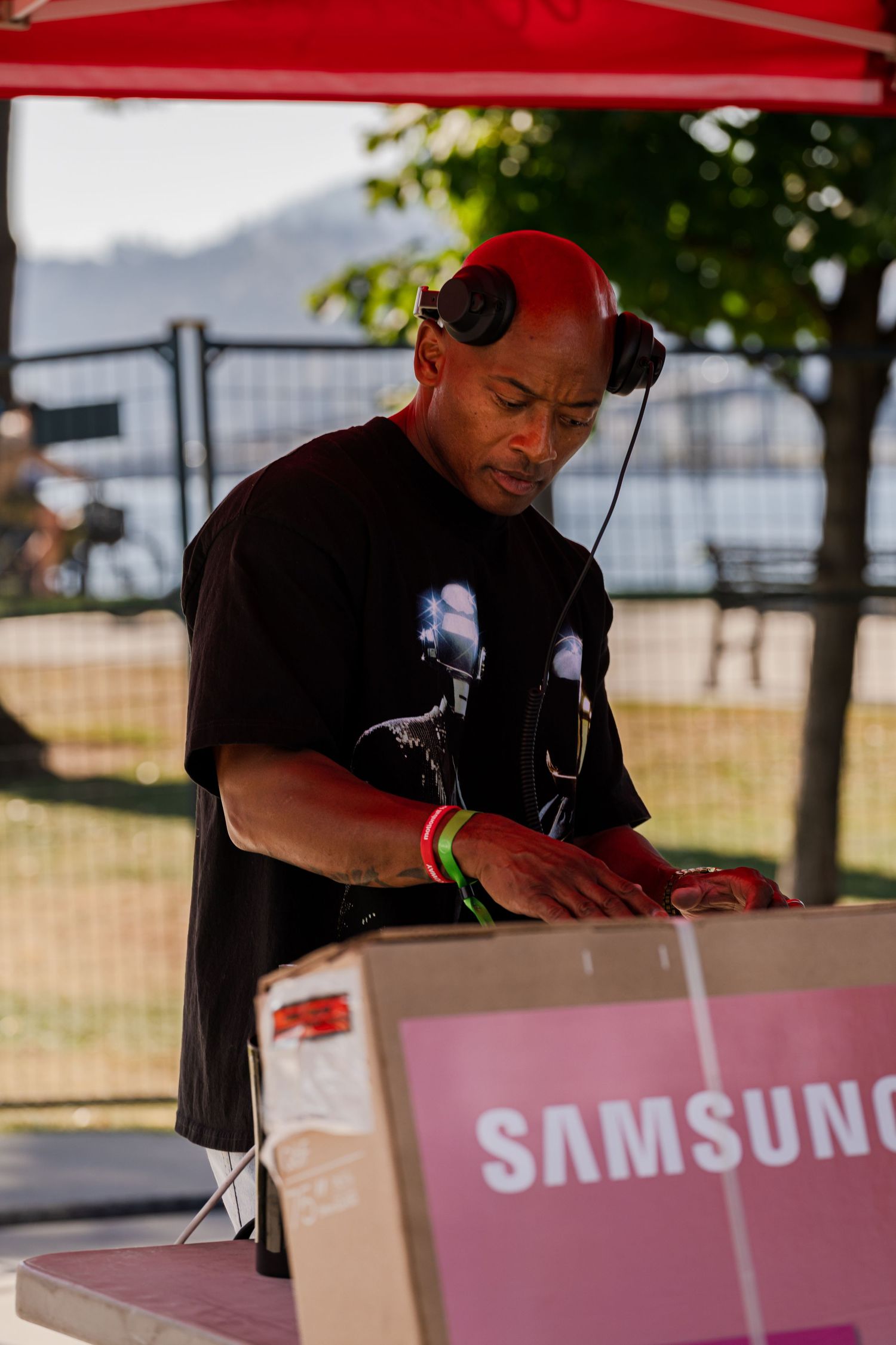 Samsung branded display setup with staff member working at outdoor event.