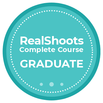 RealShoots Complete Course Graduate badge, a teal circular seal with white text and dotted border.