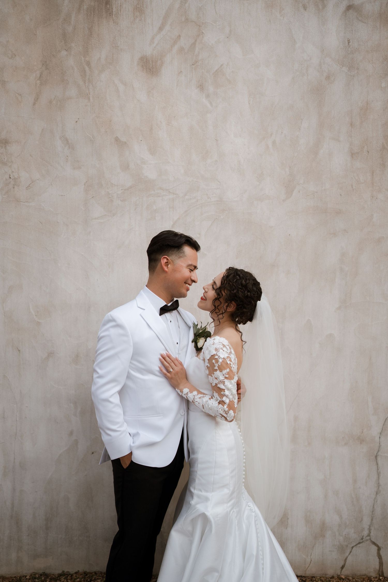 lost mission wedding venue couples stucco wall