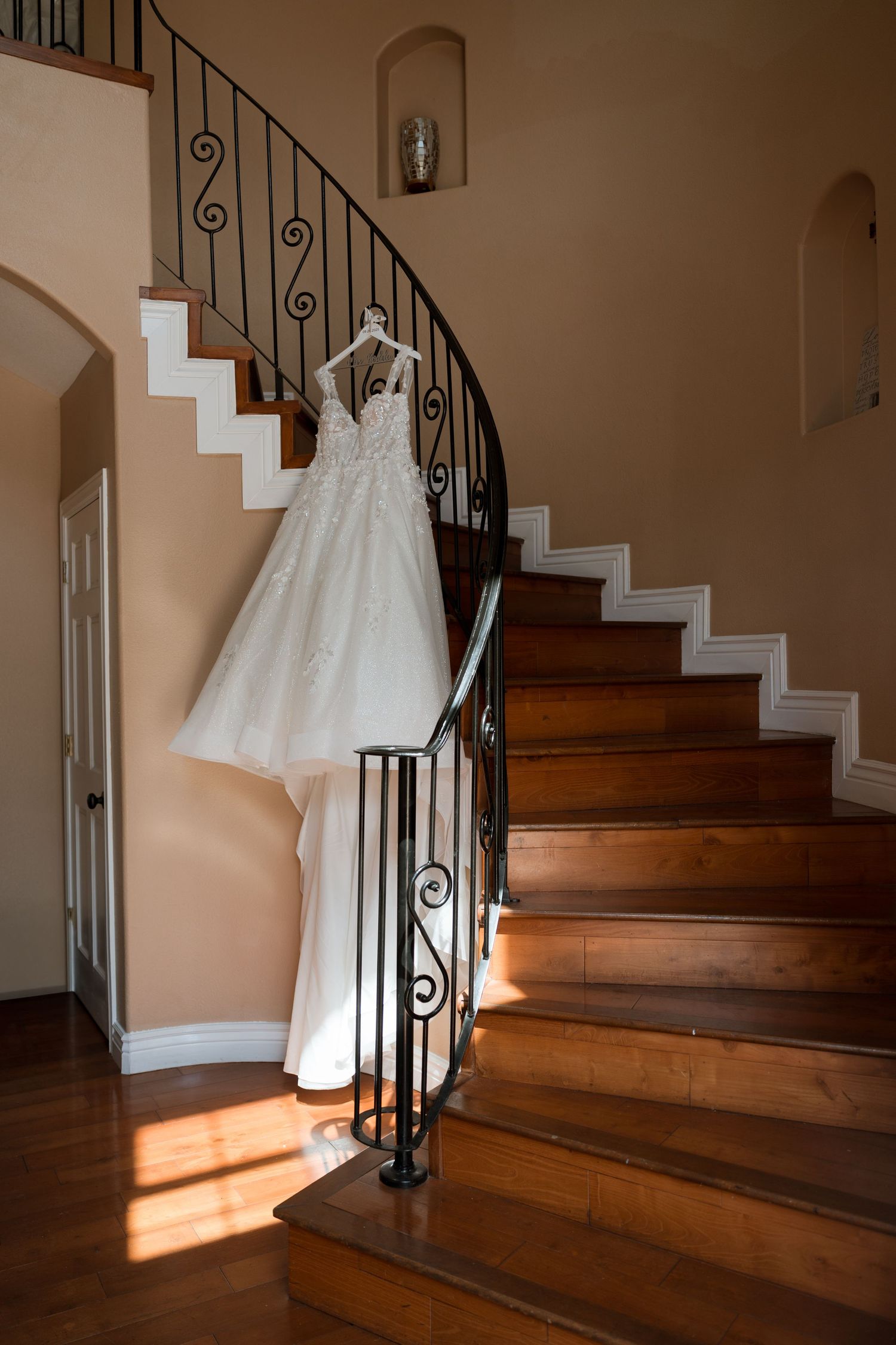The gardens of cransebury view brides dress in spiral staircase