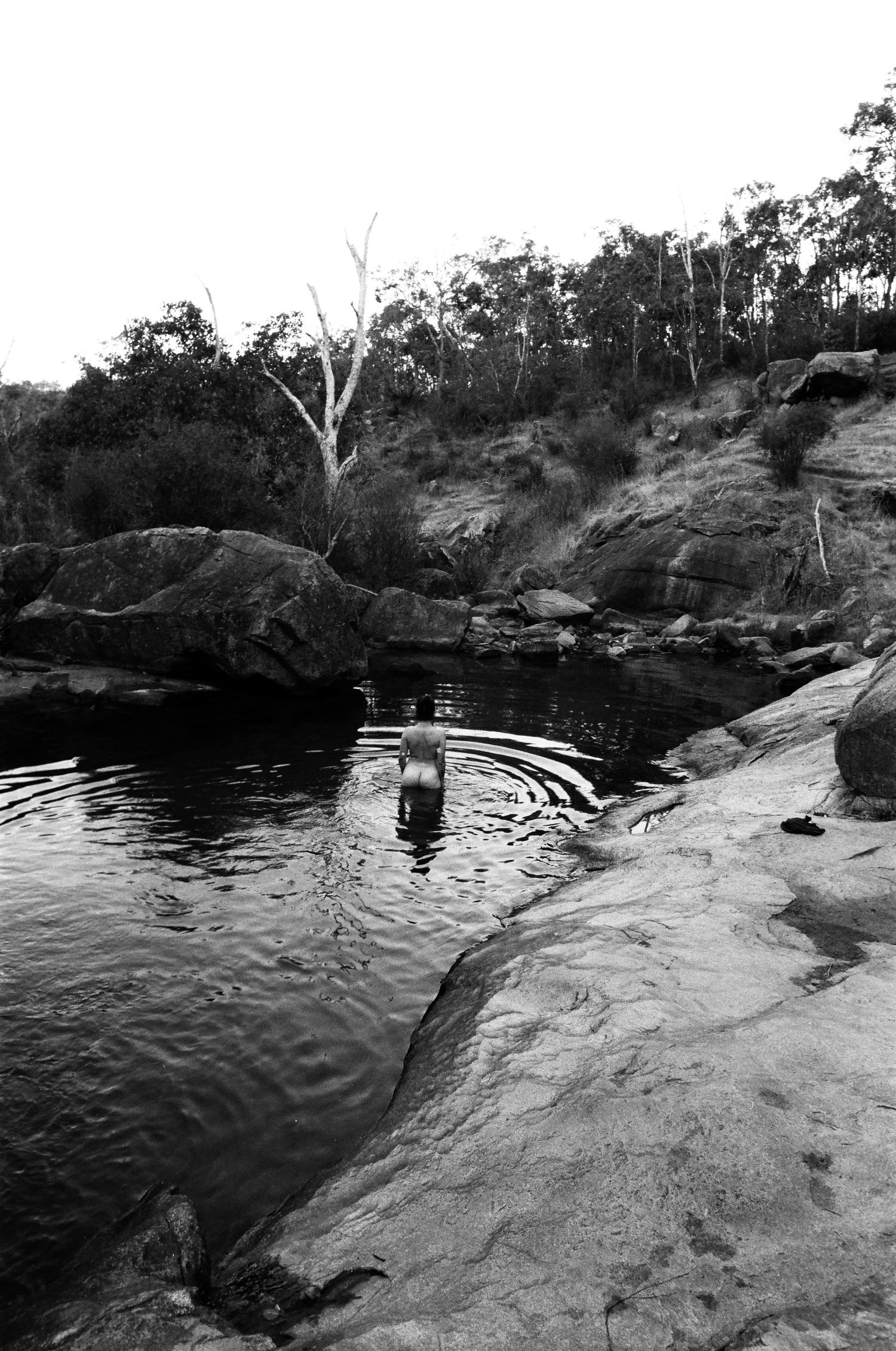 Quiet rock pool portrait near Perth, earthy tones and still water.