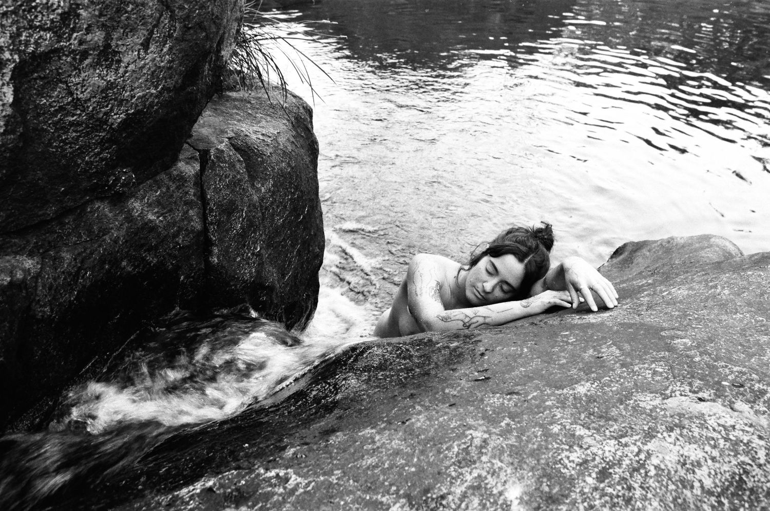 Embodied feminine presence, water moving gently around her — sunrise film session in the hills outside Perth.