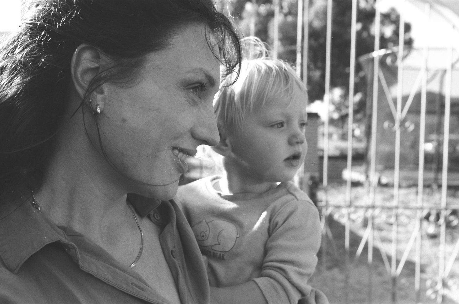 Authentic family photos of a Perth family with twins, captured during a playful backyard session.