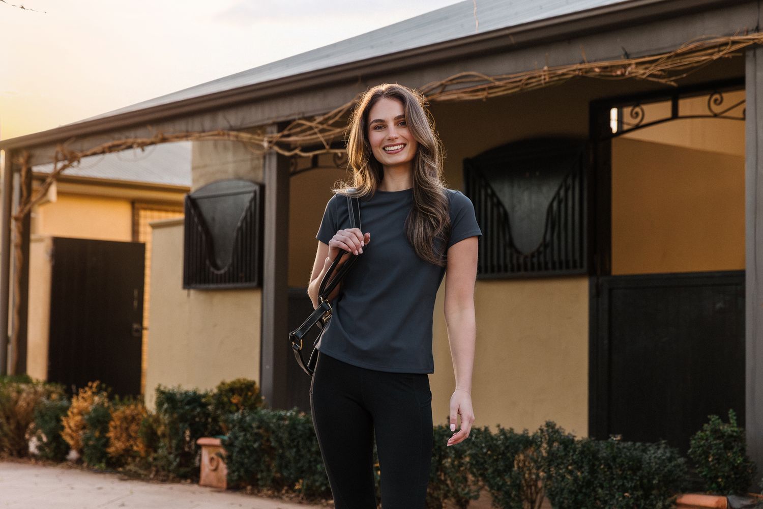 image of model posing with halter at spring creek equine commercial photoshoot