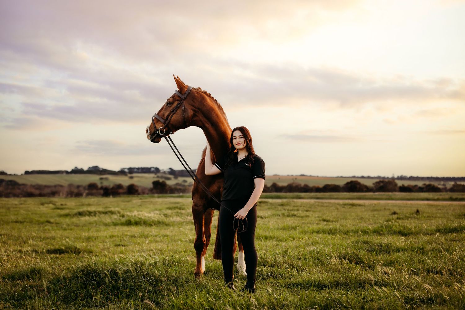image of woman and horse at sunset posing for portraits in geelong