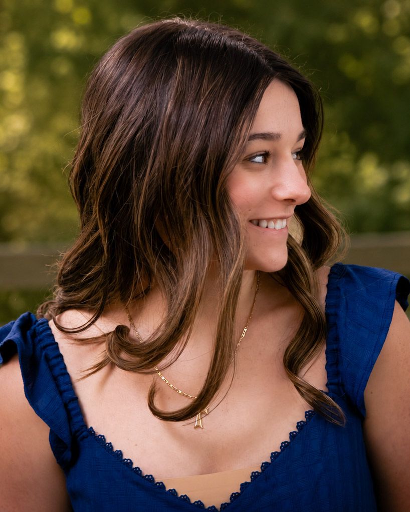 Woman photographed during a couples or lifestyle session with relaxed, candid posing.