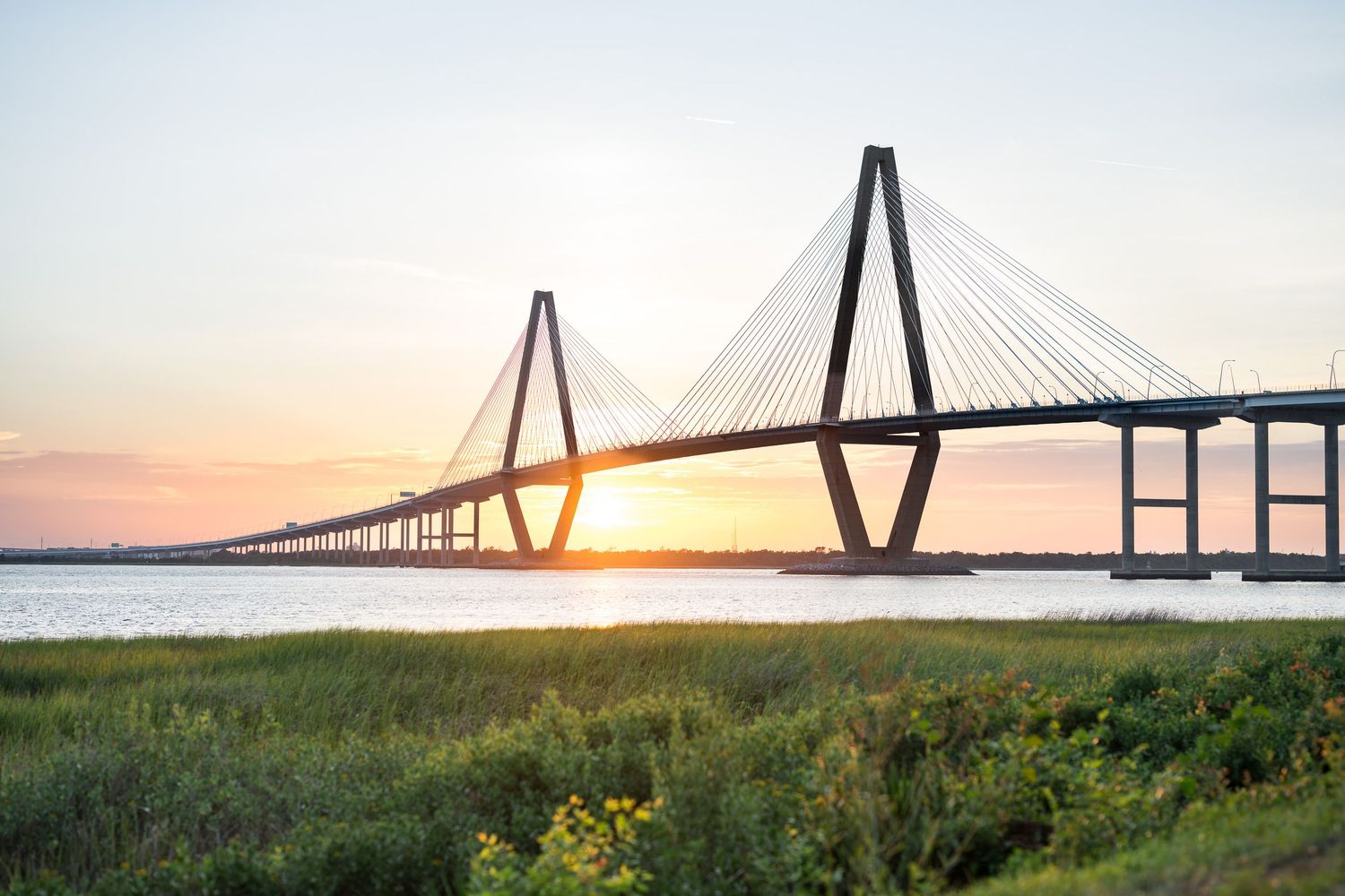 Arthur Ravenel Jr. Bridge cable-stayed suspension bridge over Cooper River at golden sunset in Charleston, SC.