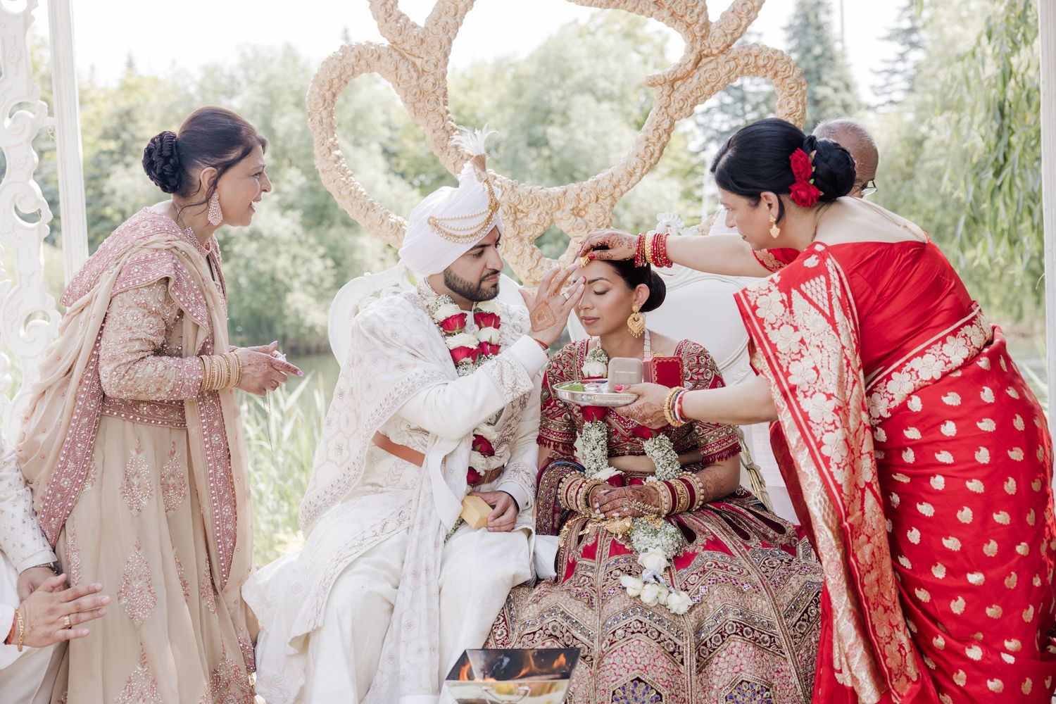 A collage of wedding photos showing traditional South Asian bridal attire in soft pink and red colors.