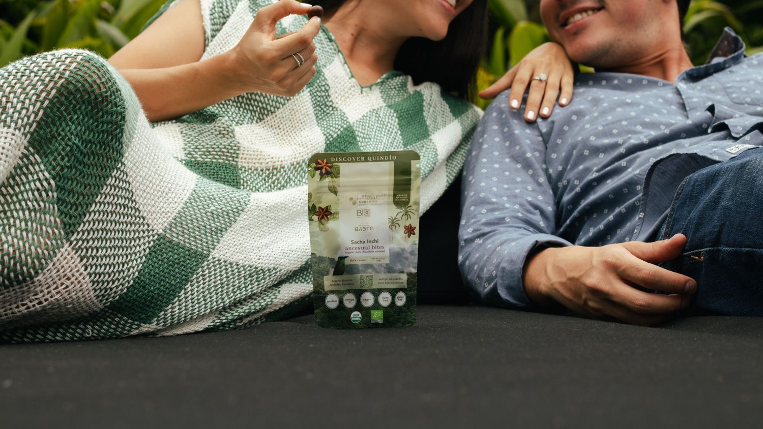 Product display on black surface with green and white checkered blanket.