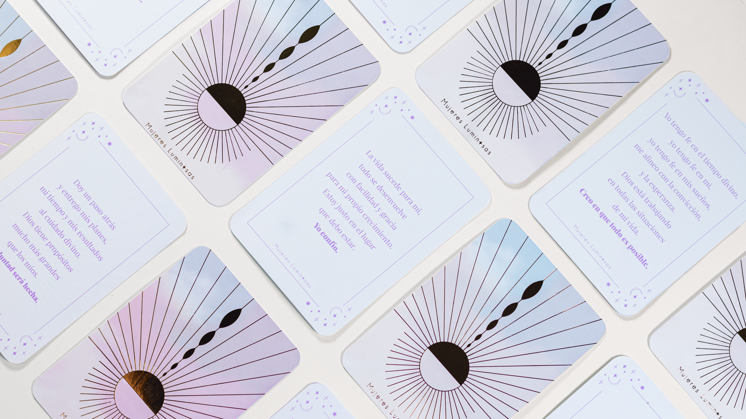 Array of elegant tarot cards featuring minimalist sun ray designs in pastel colors.