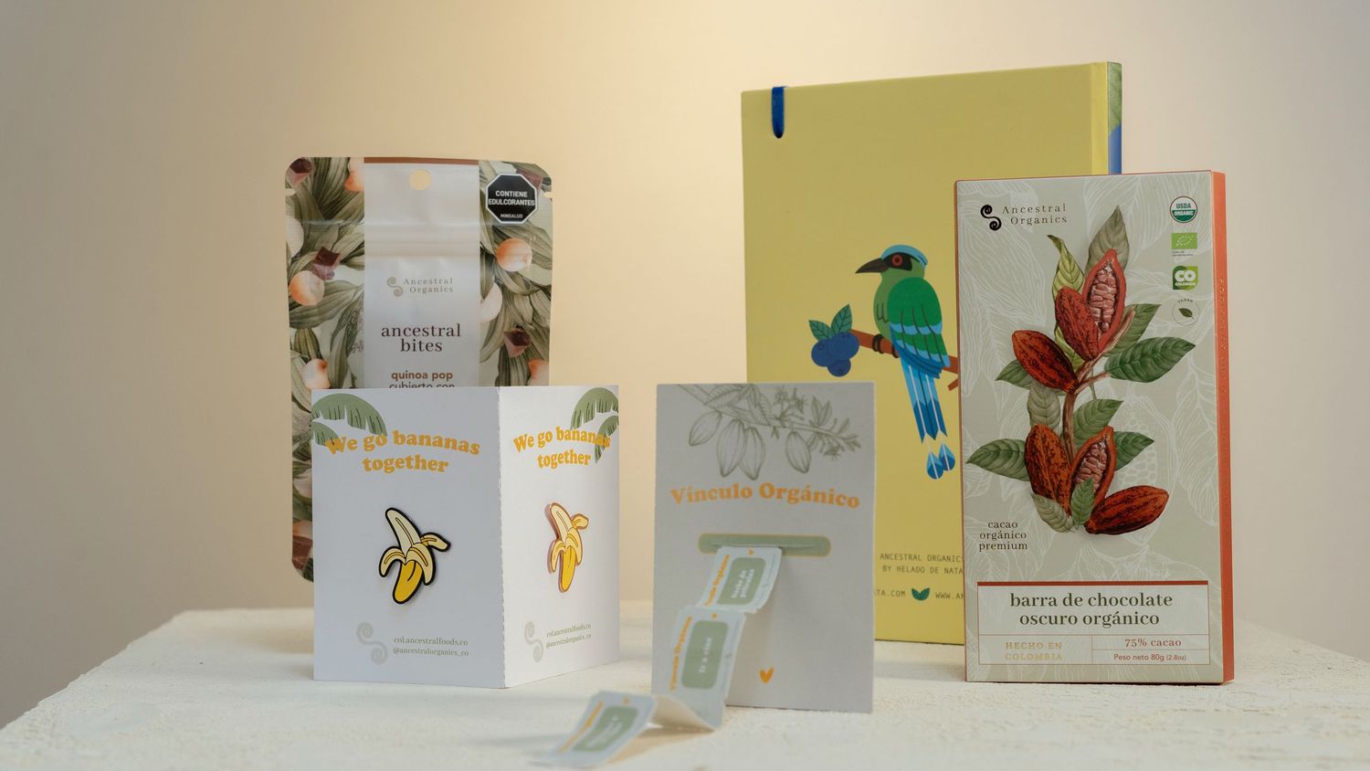 Collection of organic products with decorative bird and floral packaging designs.