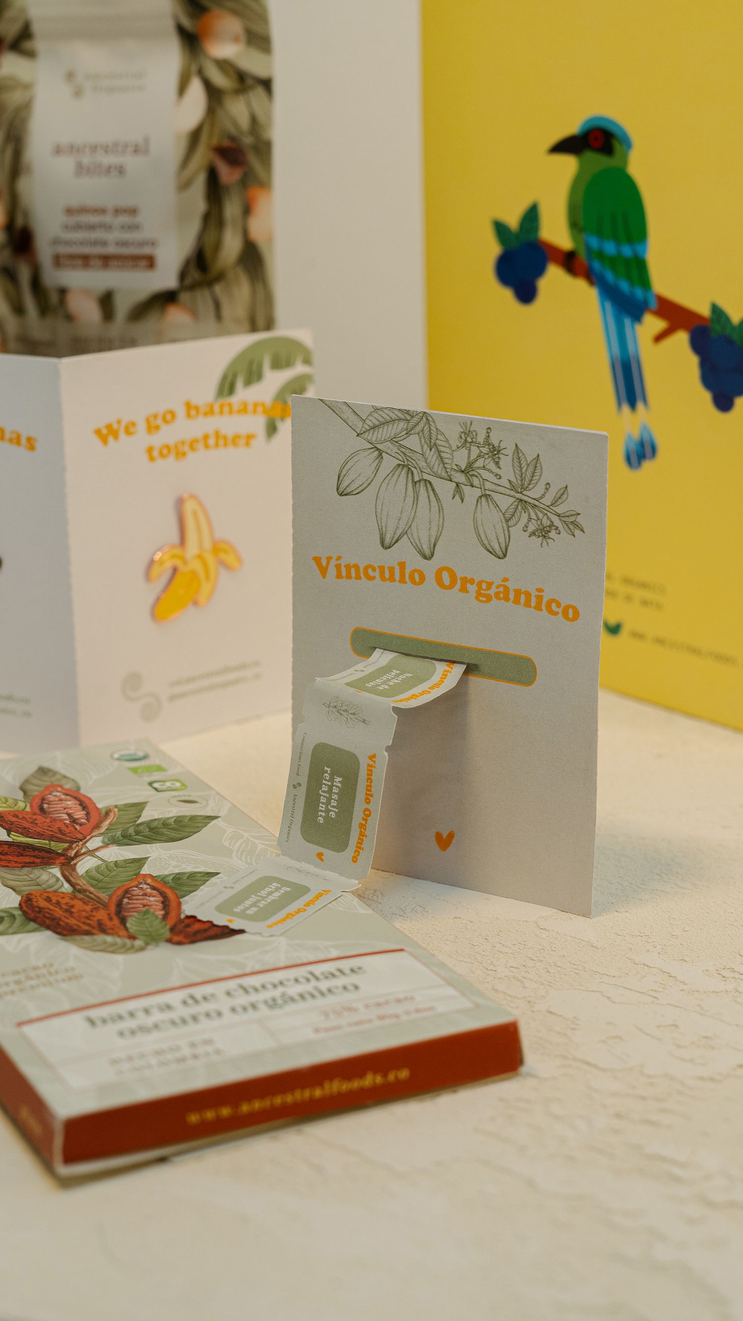 Marketing materials featuring organic products with blue bird illustration and banana graphics.