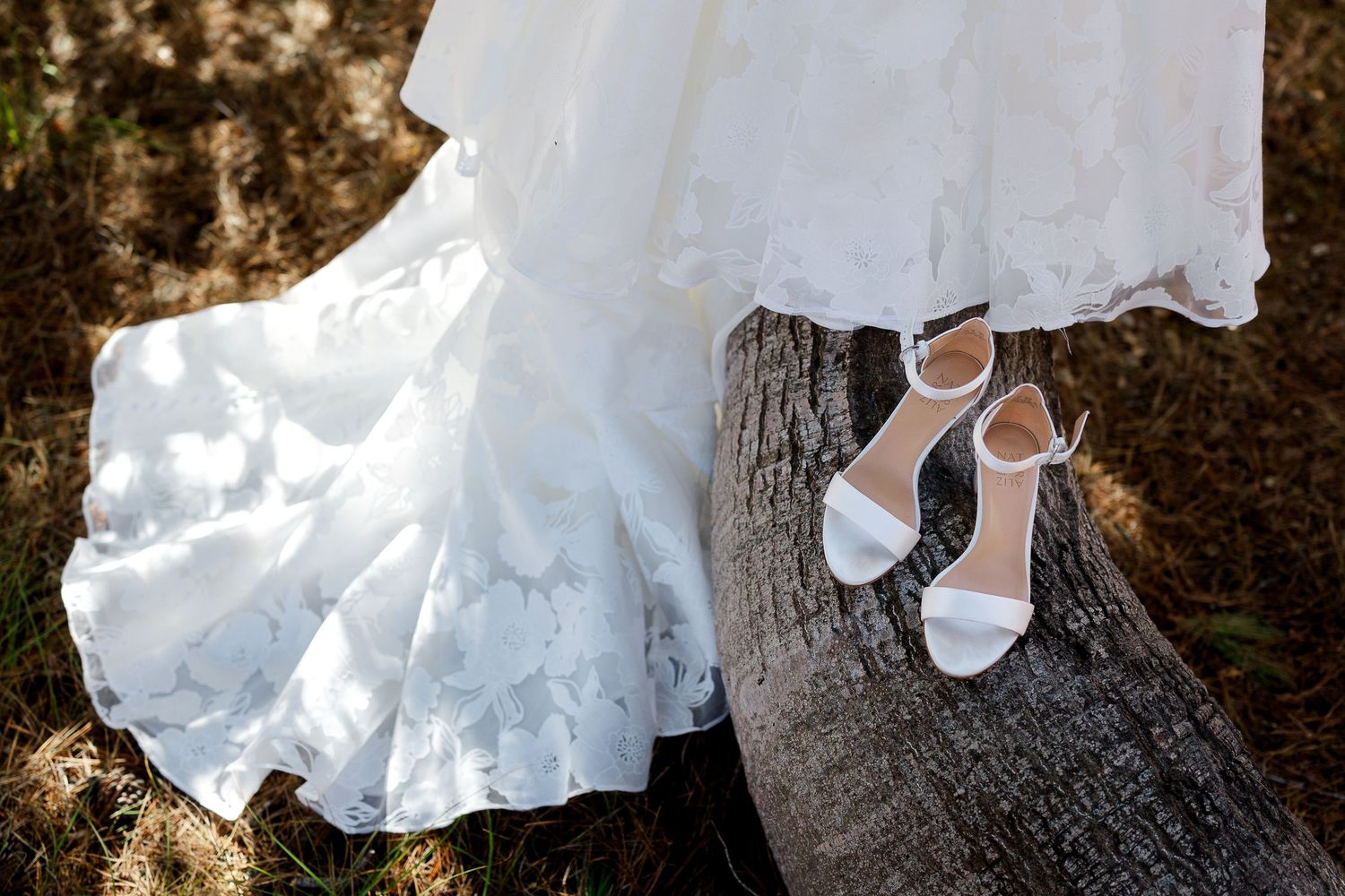 A series of wedding photos showing white dress details and shoes against rustic outdoor backgrounds.