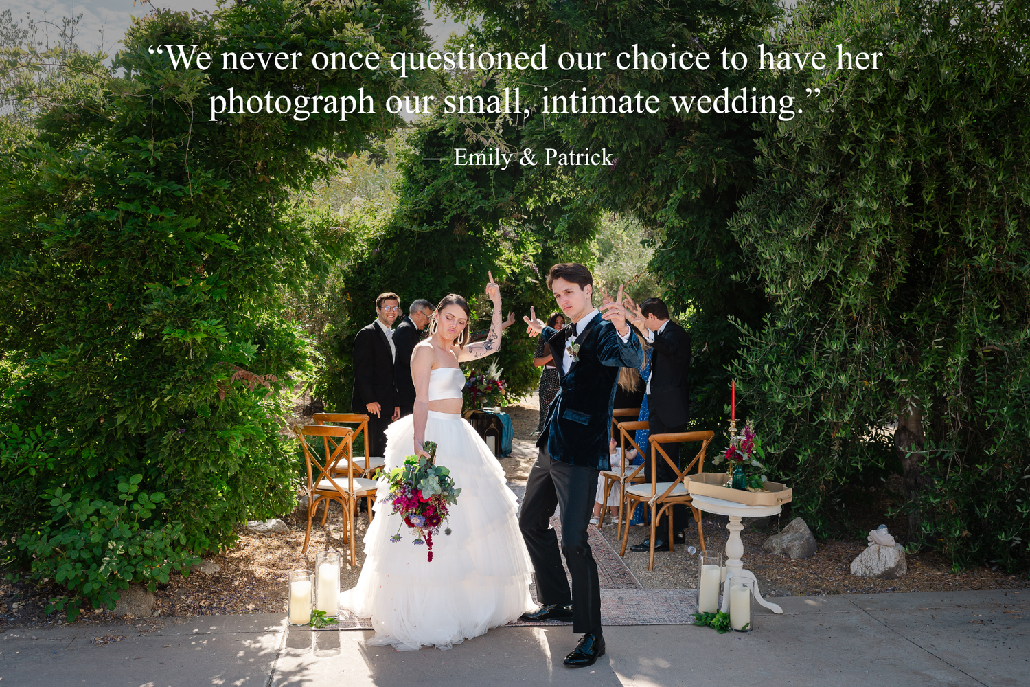 Joyful bride and groom celebrate at an intimate outdoor wedding ceremony surrounded by lush greenery and wooden chairs.