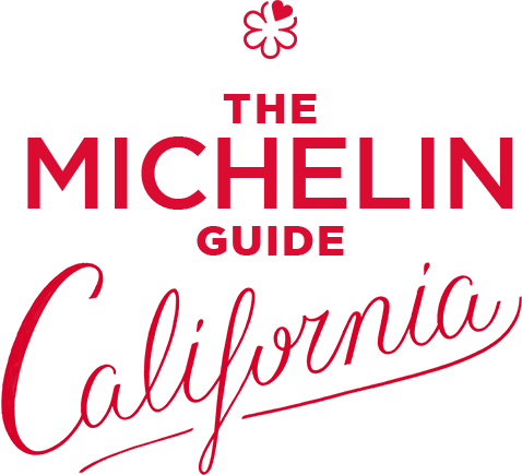 Red Michelin Guide logo with elegant cursive text and decorative flourishes.