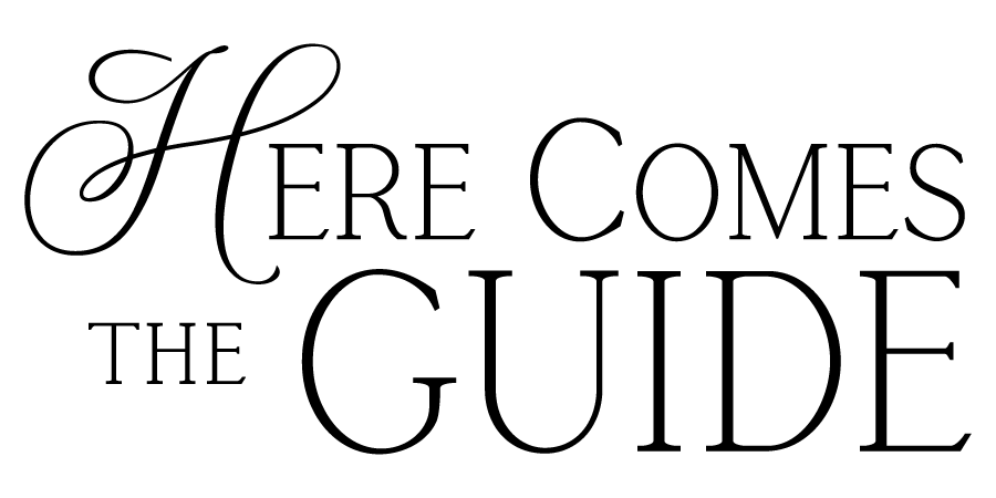 Decorative text reading 'Here Comes The Guide' in an elegant calligraphic script style.