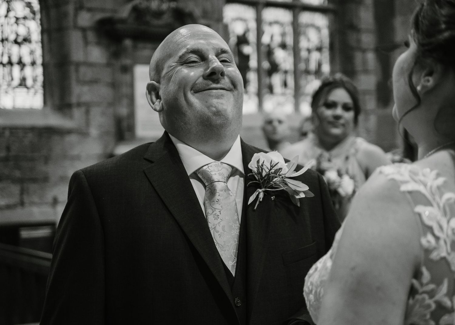 St Marys Church Sheffield - Black and white wedding photos captured inside a church with stained glass windows.
