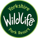 Yorkshire Wildlife Park Resort circular green logo featuring bold white and yellow text with a paw print accent.