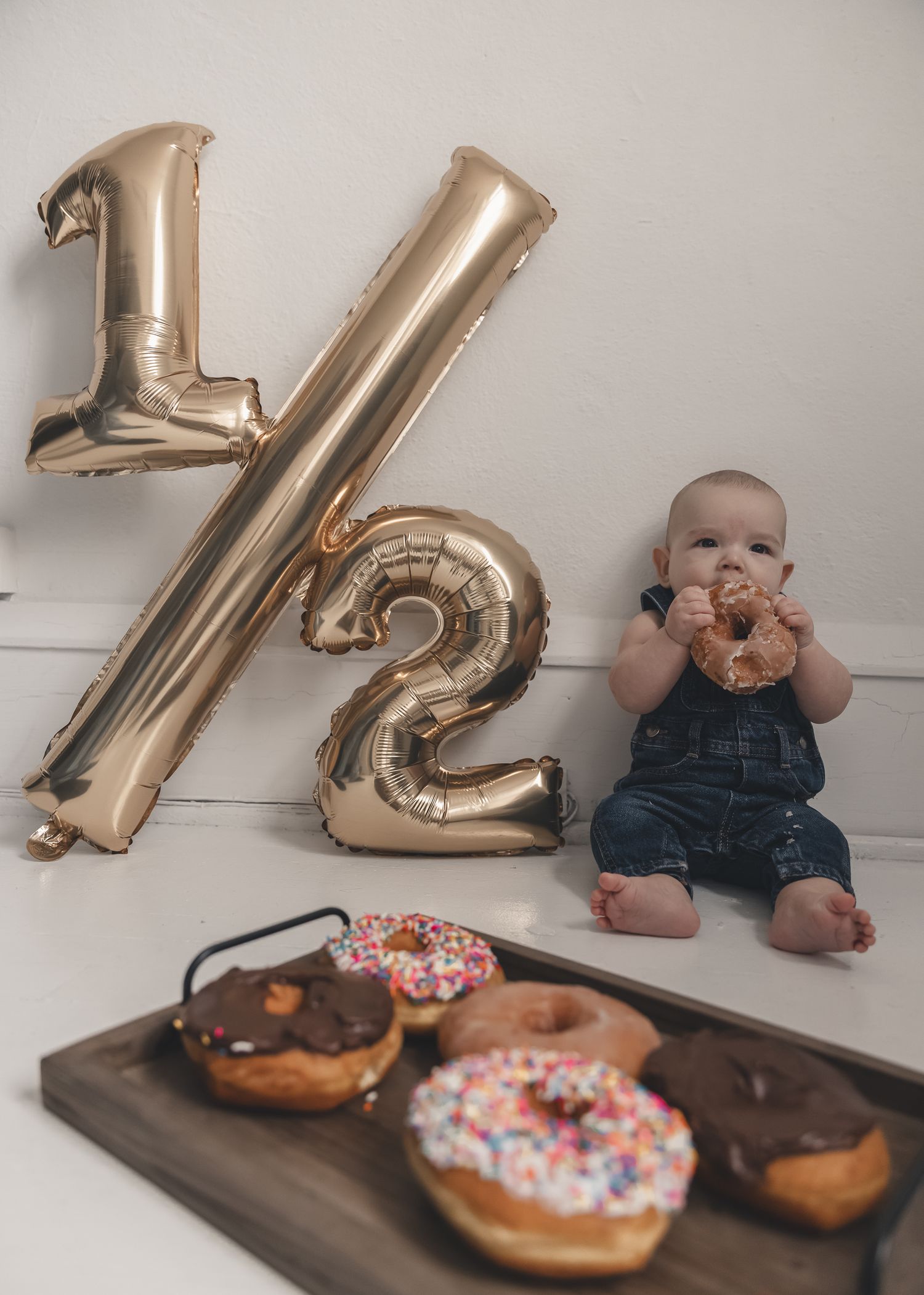 Celebrating a half-birthday calls for donuts, cuddles, & capturing the cutest little moment to remember just how sweet this stage really is.