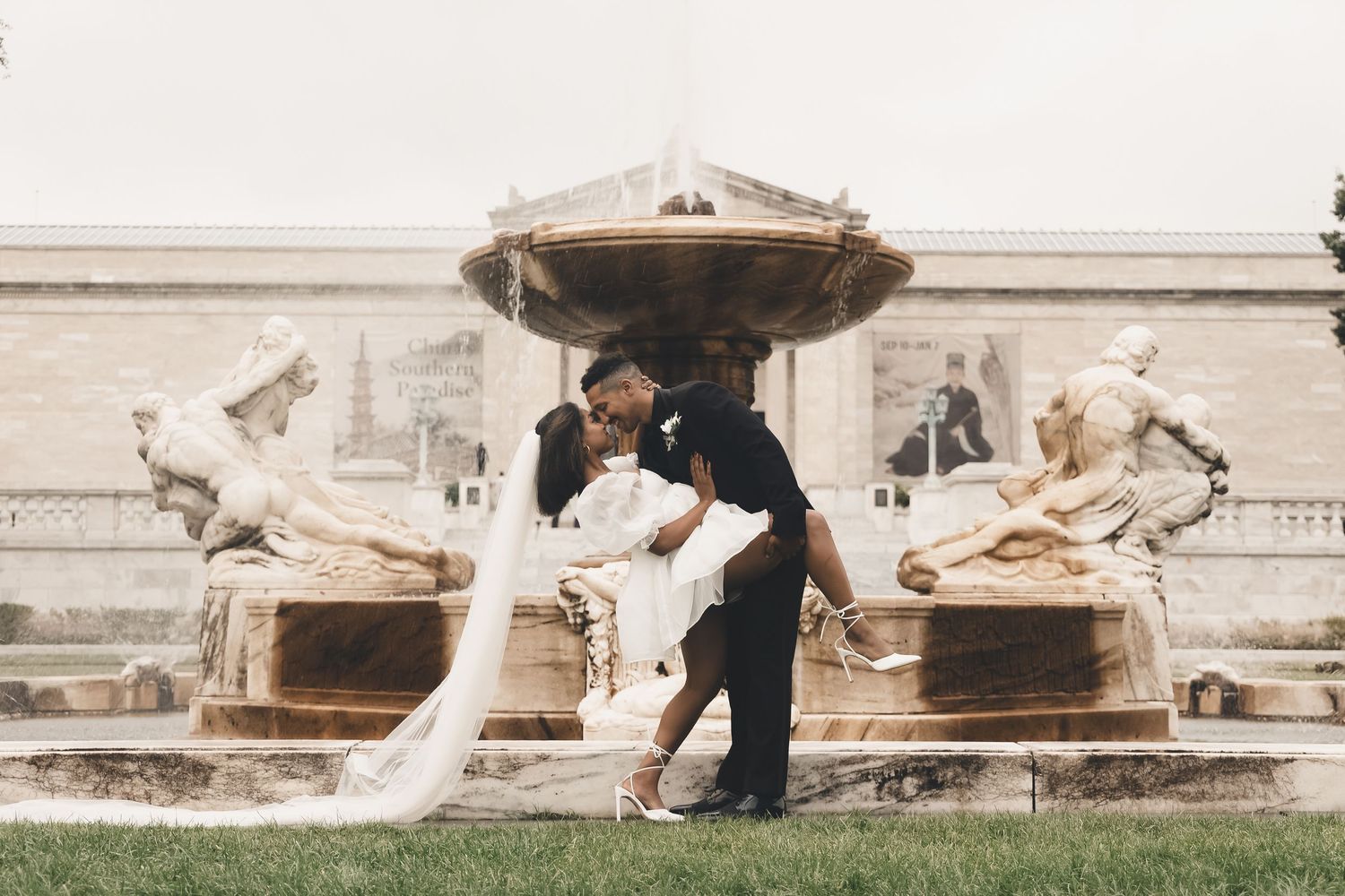Romantic wedding kiss at the Cleveland Museum of Art fountain. Timeless Northeast Ohio wedding photography.