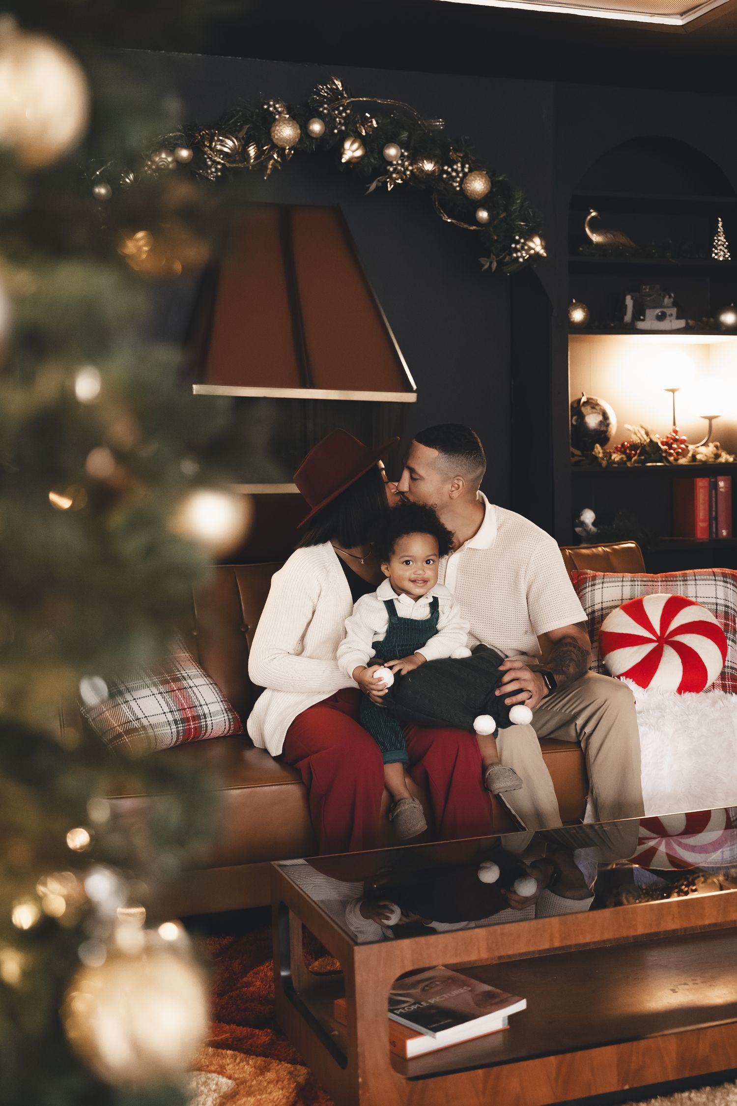 Festive Christmas family studio session in Cleveland, Ohio — warm moments, holiday joy, and cozy memories captured by the tree.