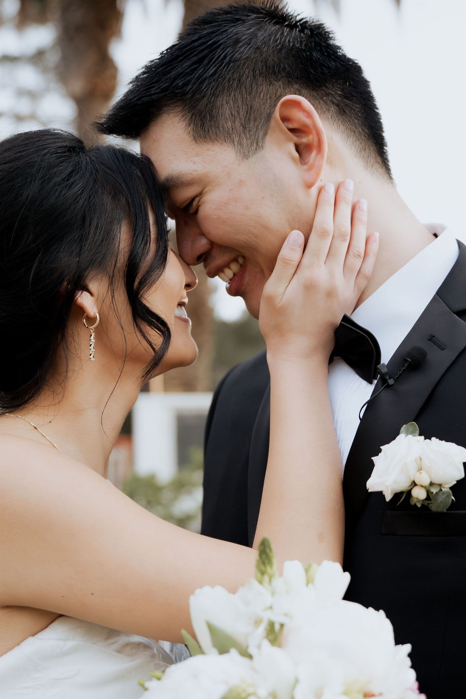 Bride and groom smiling at outdoor wedding ceremony in Los Angeles
