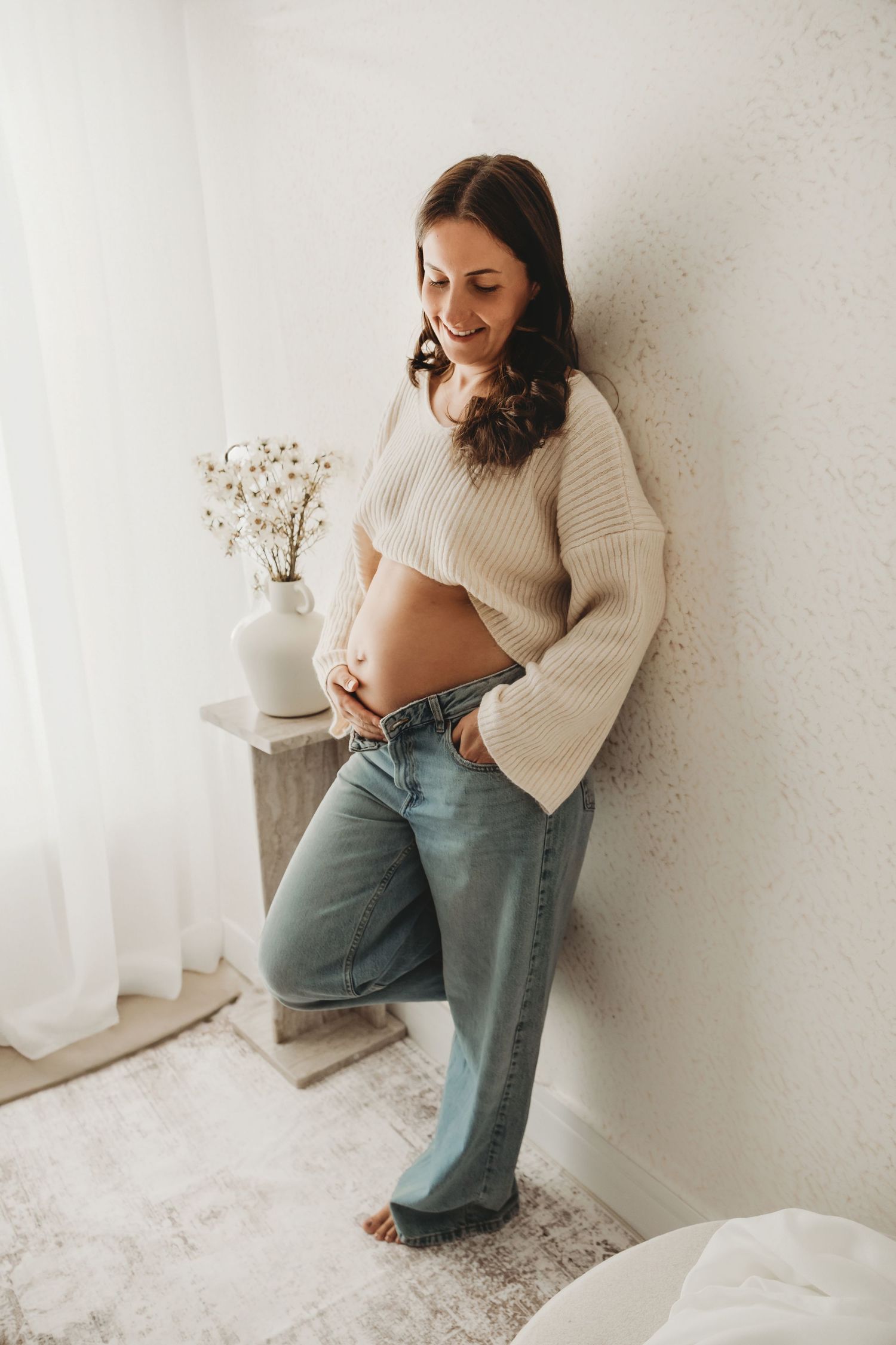 Expectant mother posing during a natural maternity photography session.