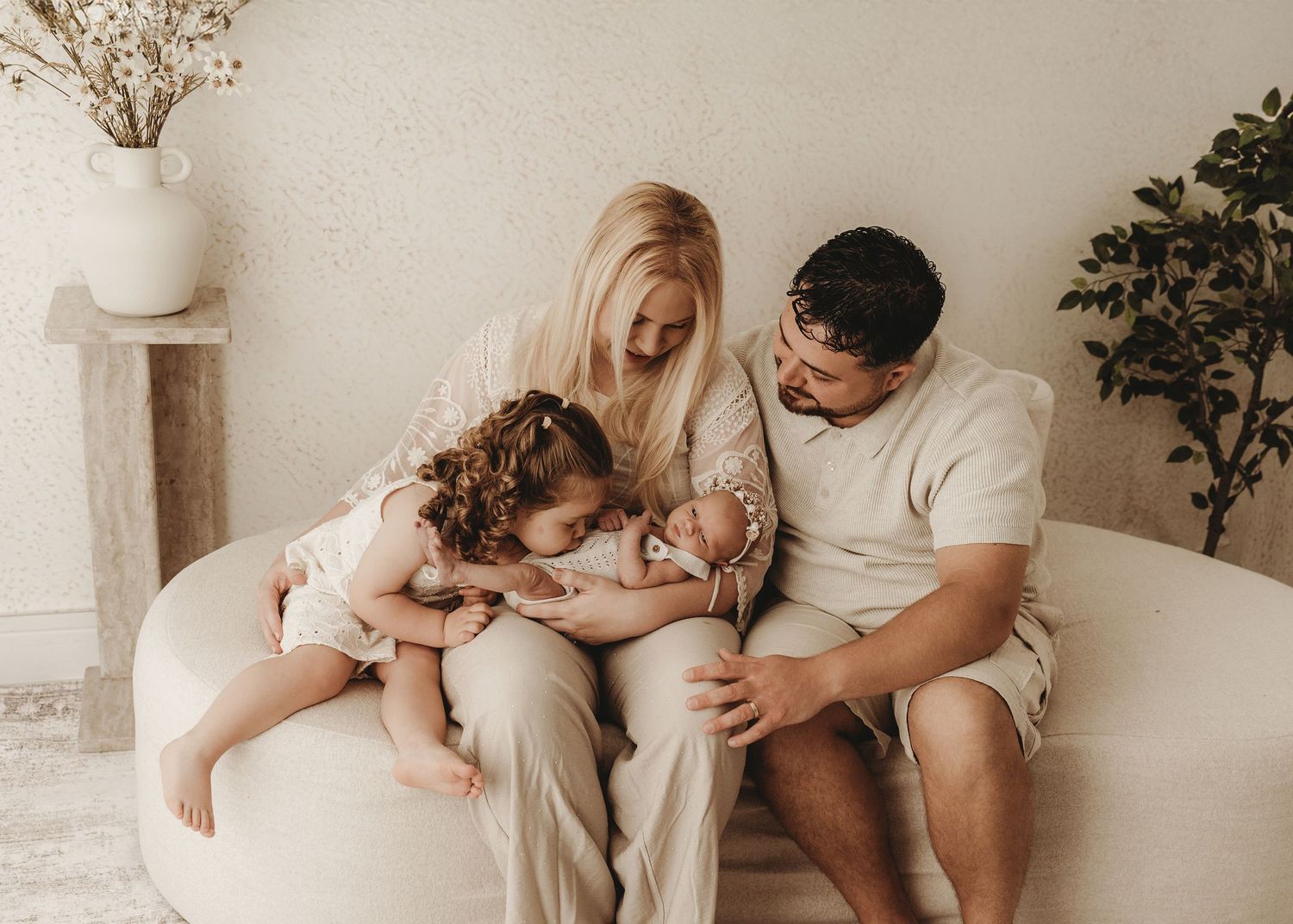 Family cuddling together during a relaxed photography session.