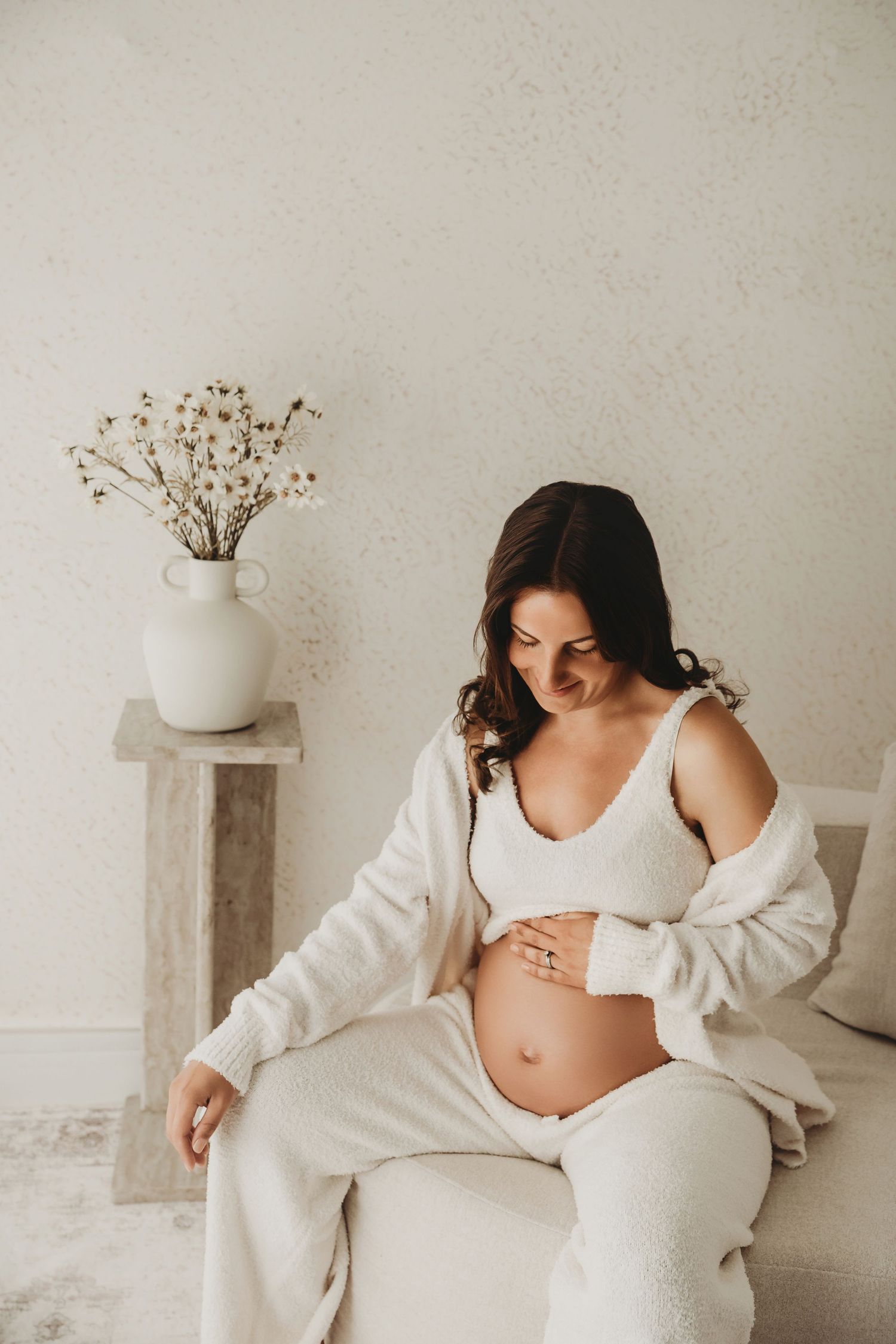 Expectant mother posing during a natural maternity photography session.