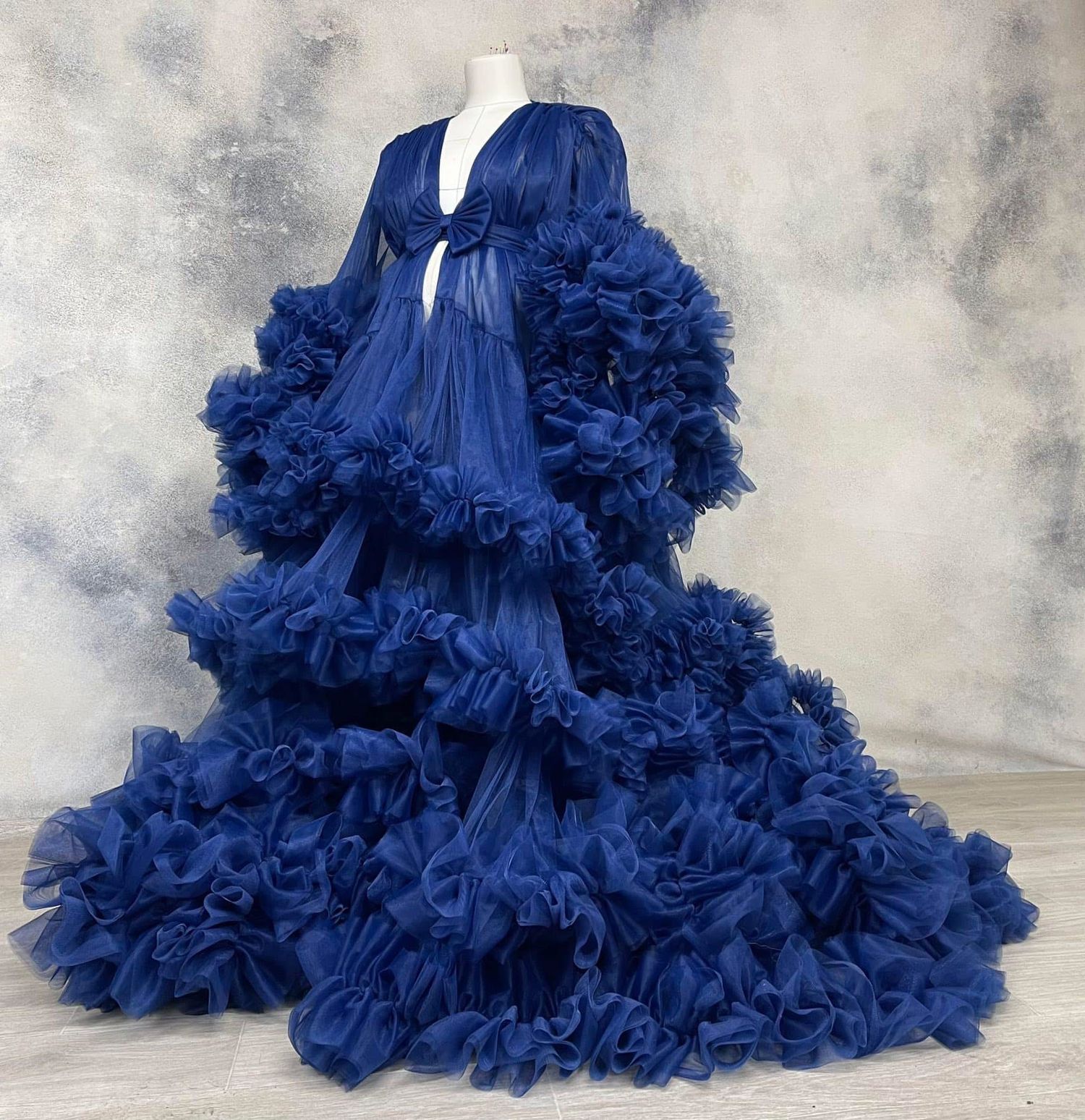 Navy blue long-sleeve ruffled tulle maternity robe on a mannequin.