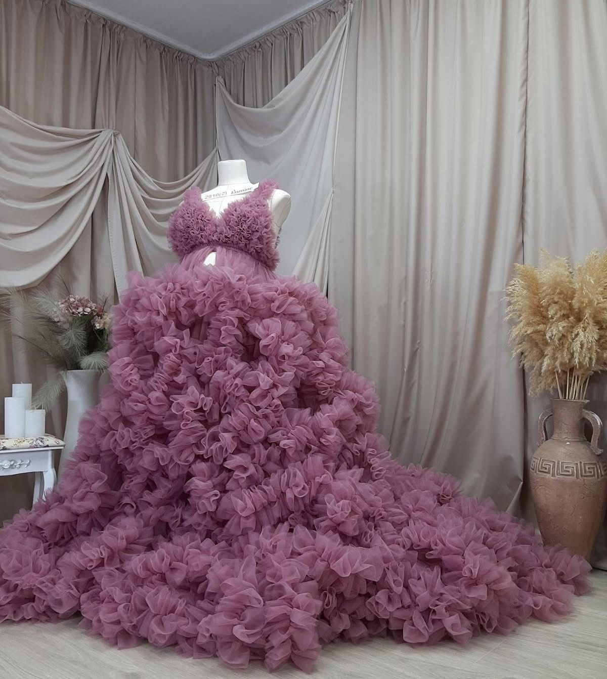 Mauve purple ruffled tulle maternity ballgown with cascading floral layers displayed on dress form.