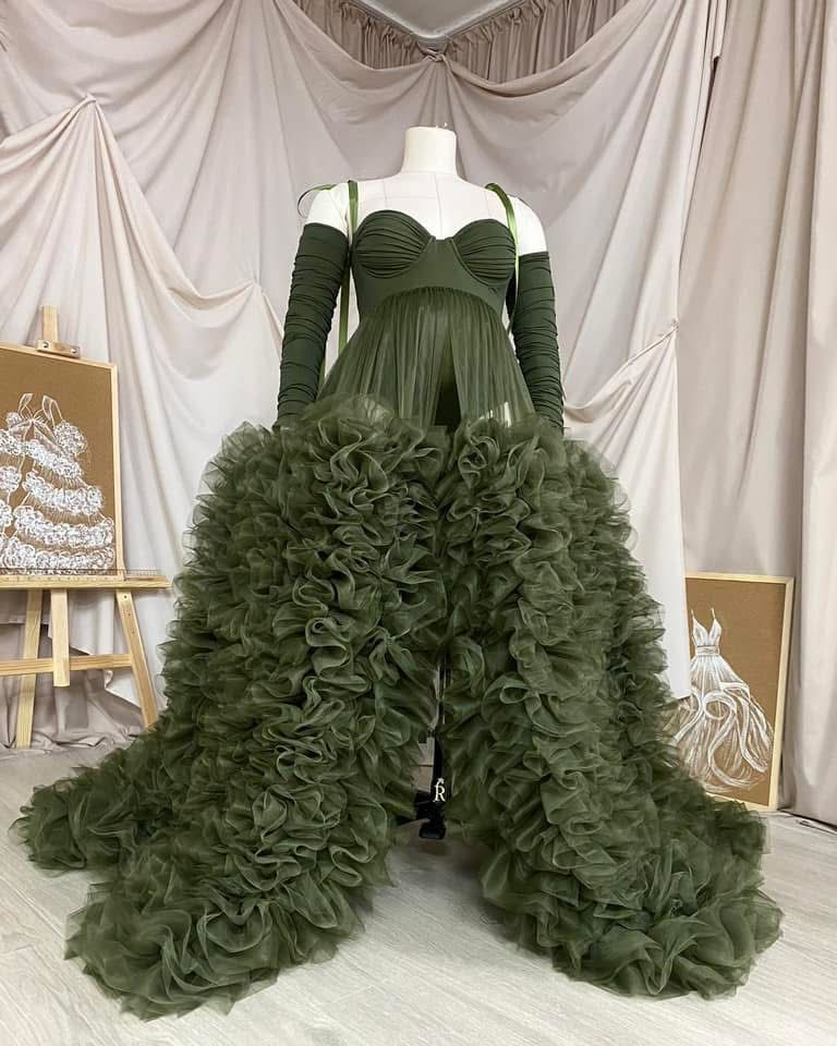 Olive green ruffle tulle high-low maternity gown with sweetheart bodice and long gloves on mannequin.