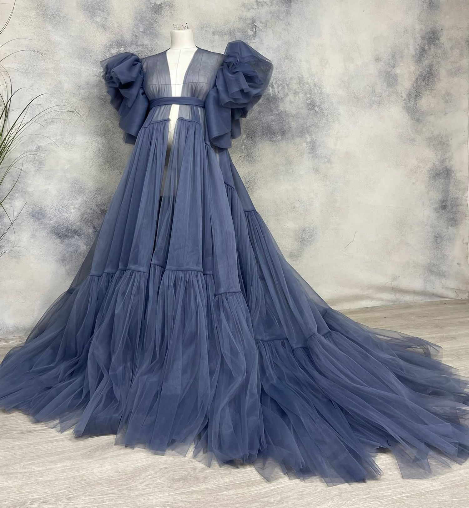 Dusty blue puff-sleeve open-front tiered tulle maternity robe on mannequin.
