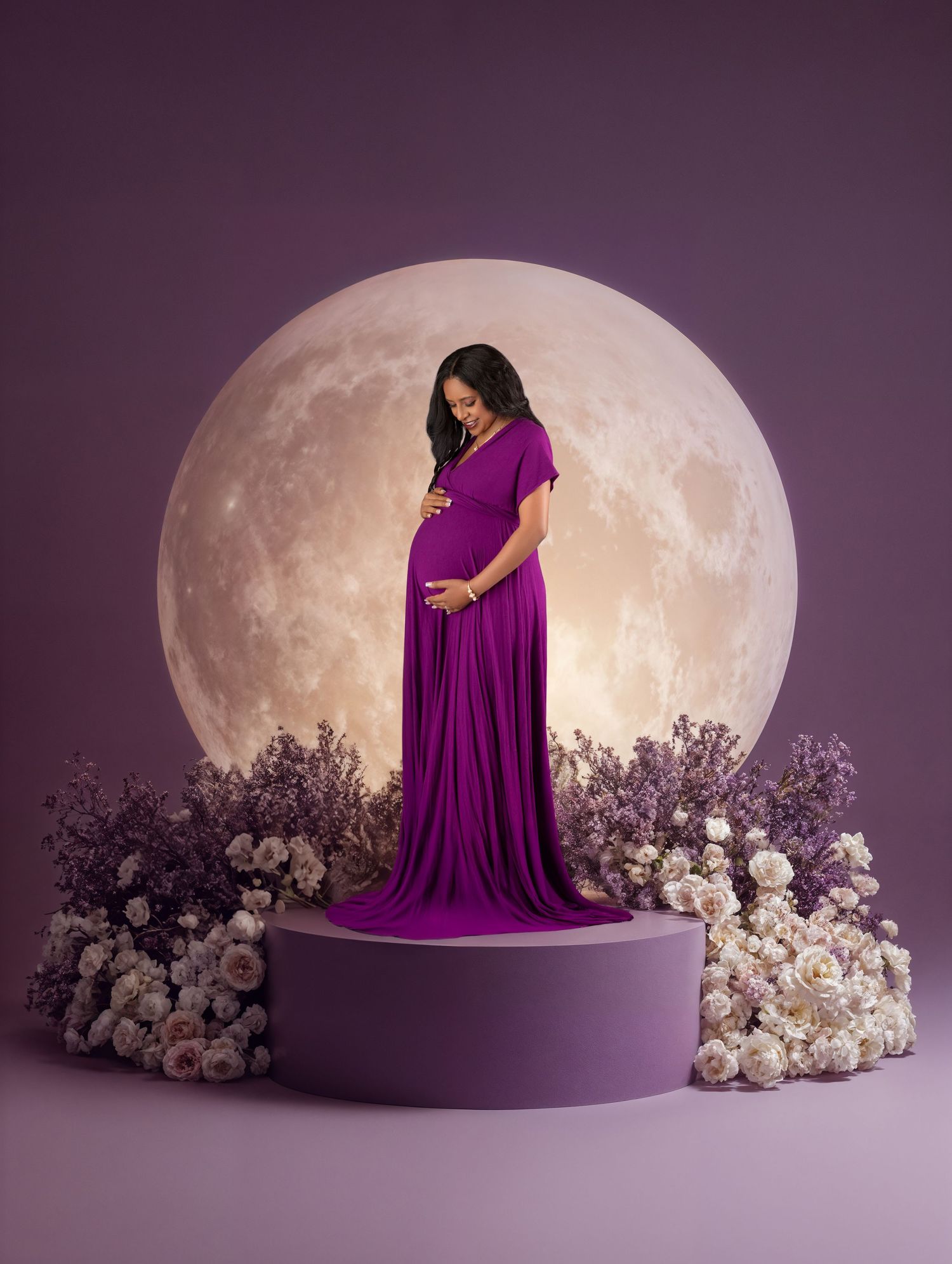 Pregnant woman in purple gown on pedestal with full moon and floral backdrop.