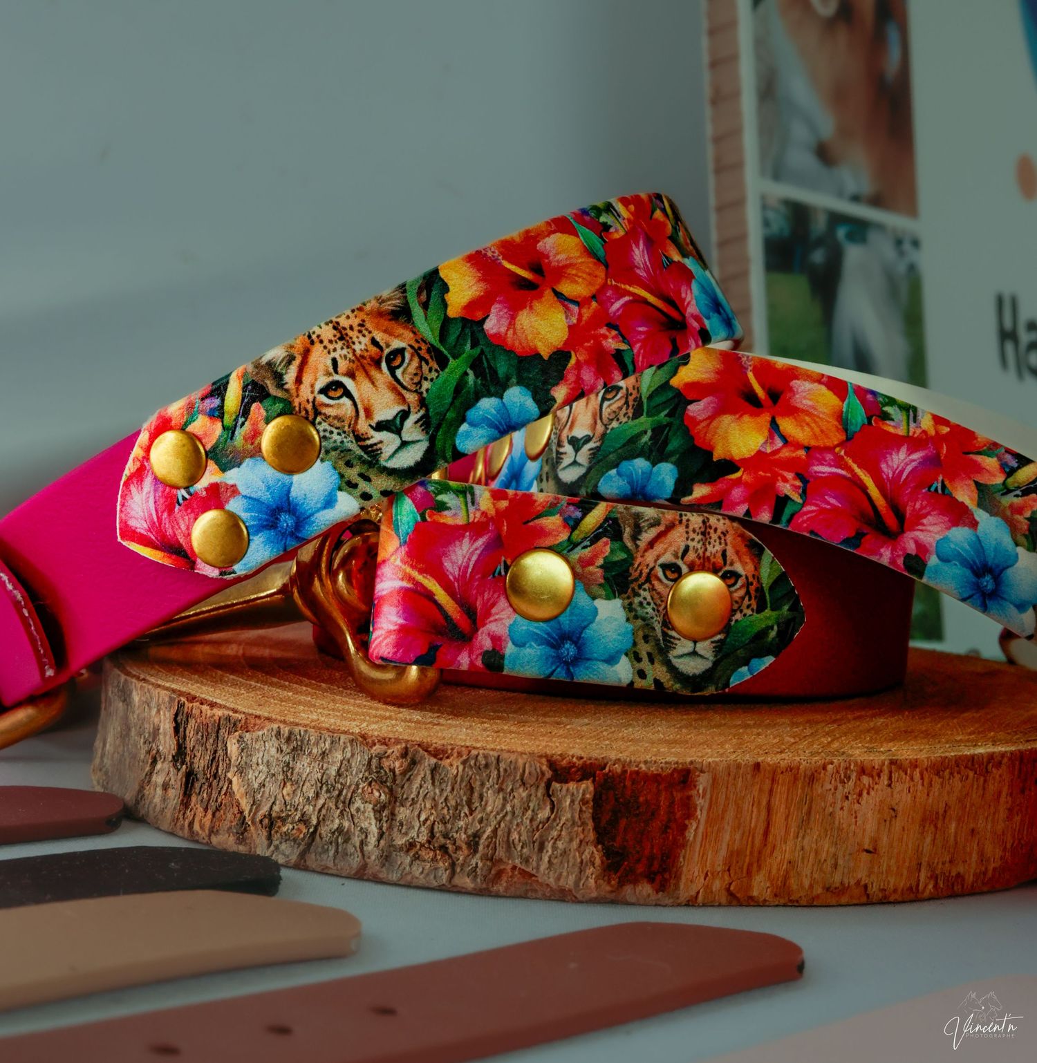 Colorful Christmas ornaments arranged on rustic wood slice display.