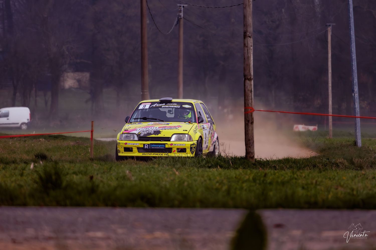 Rally cars racing on a dusty track with multiple action shots showing vehicles drifting through turns in sequence.