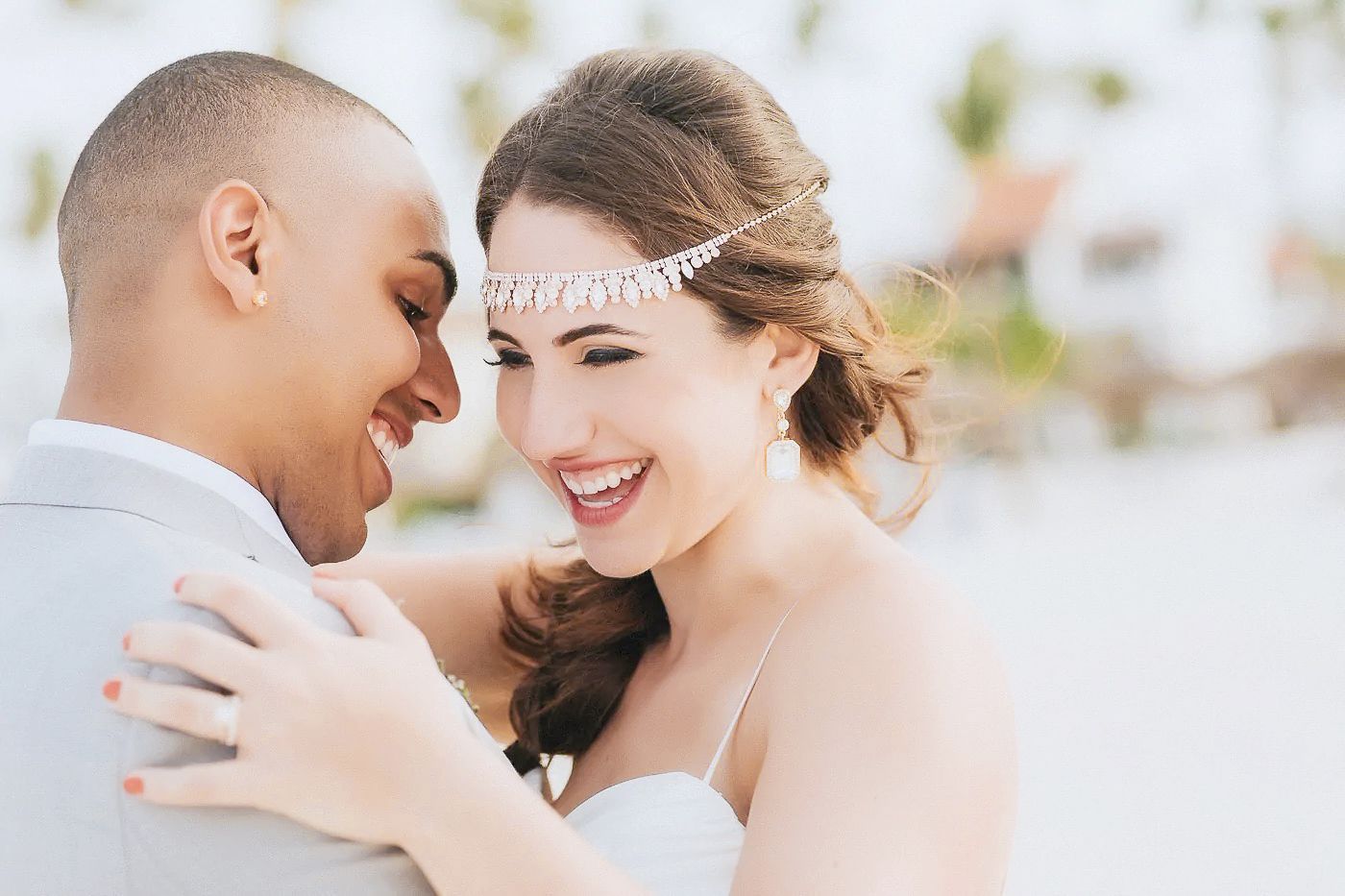 A romantic wedding couple shares intimate moments together during an outdoor photo session.