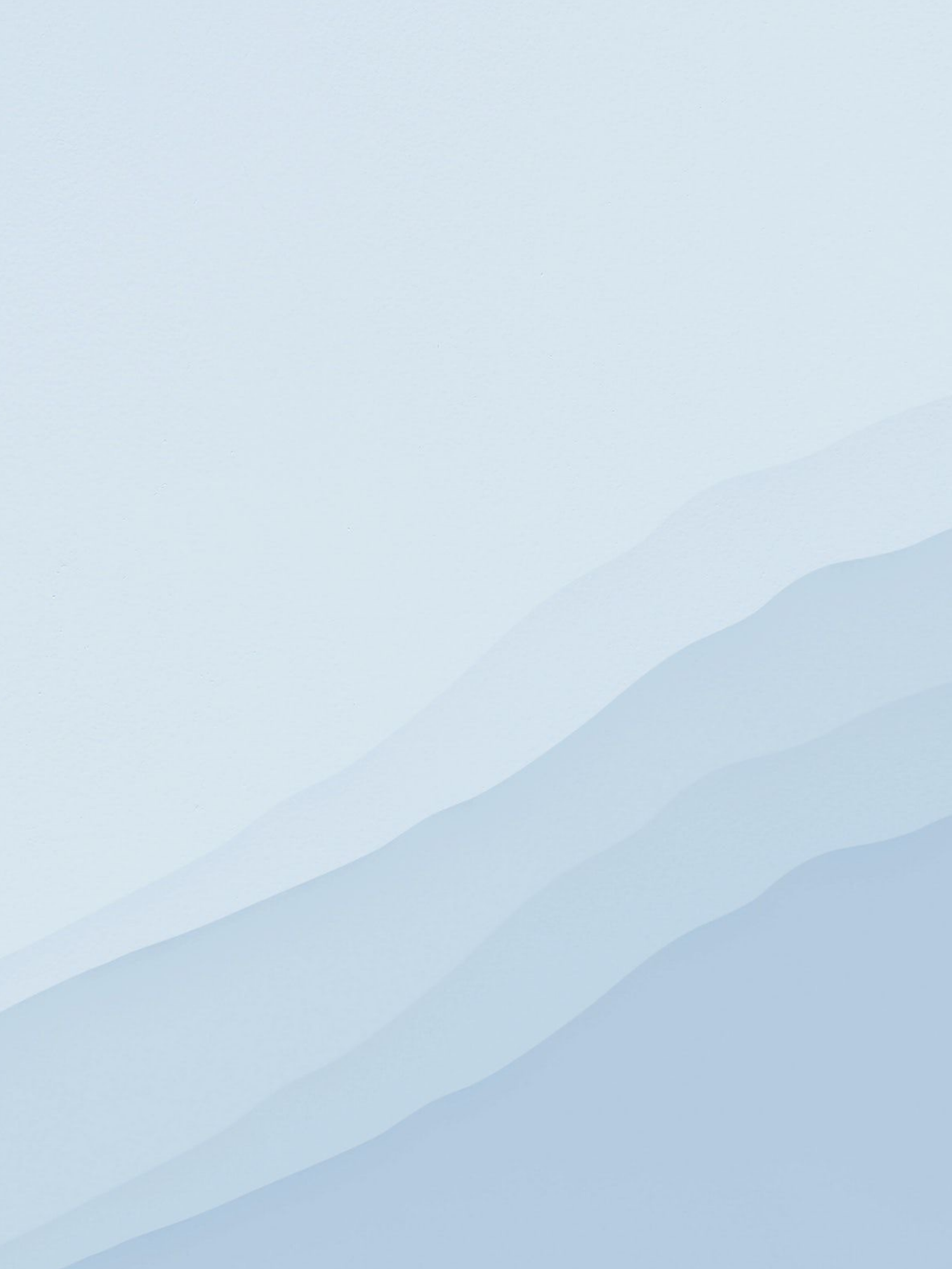 Abstract geometric pattern of layered mountains in light blue and white tones creates a minimalist landscape design.
