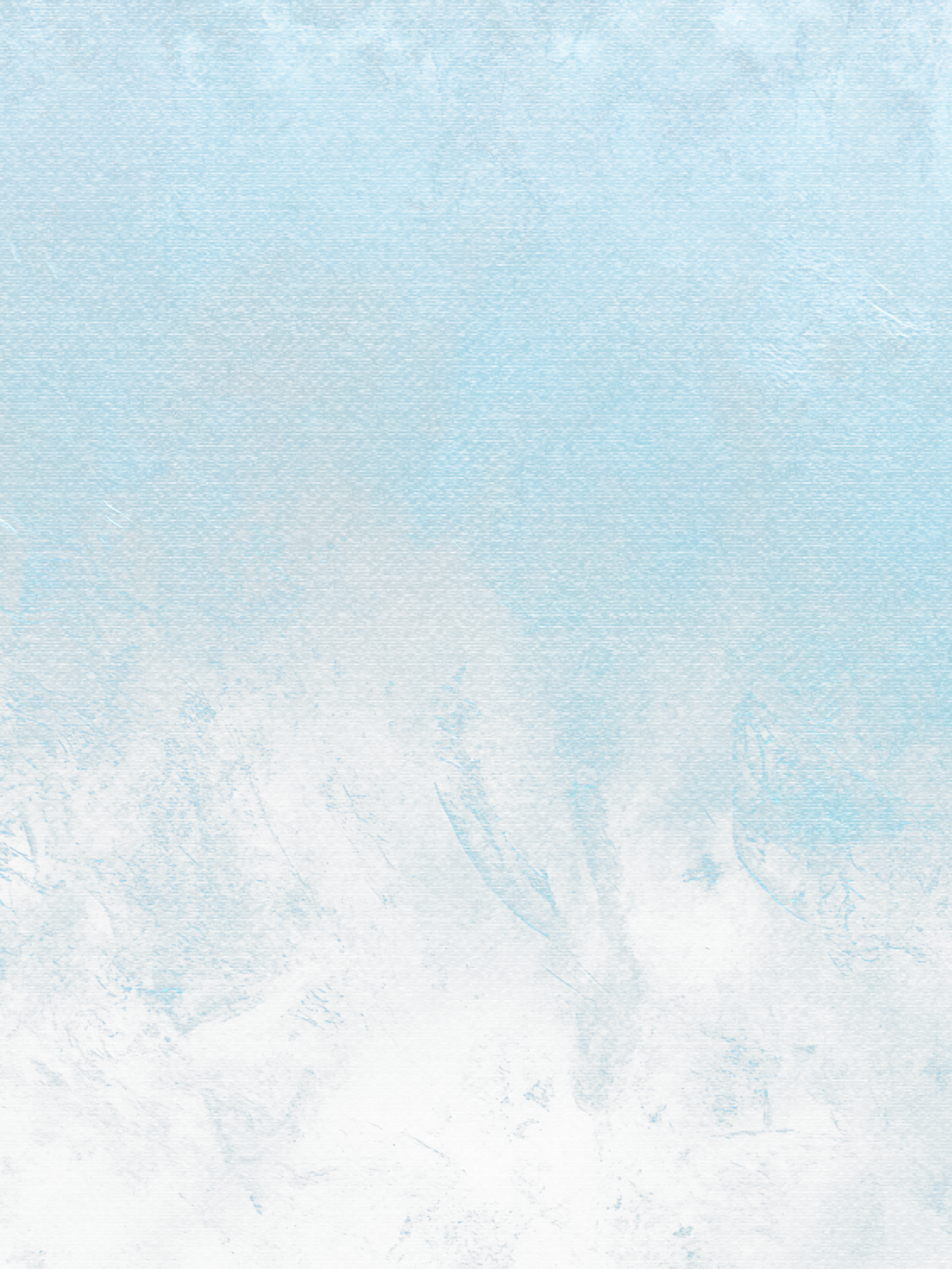 A snowy winter landscape with evergreen trees and mountains in the background under a pale blue sky.