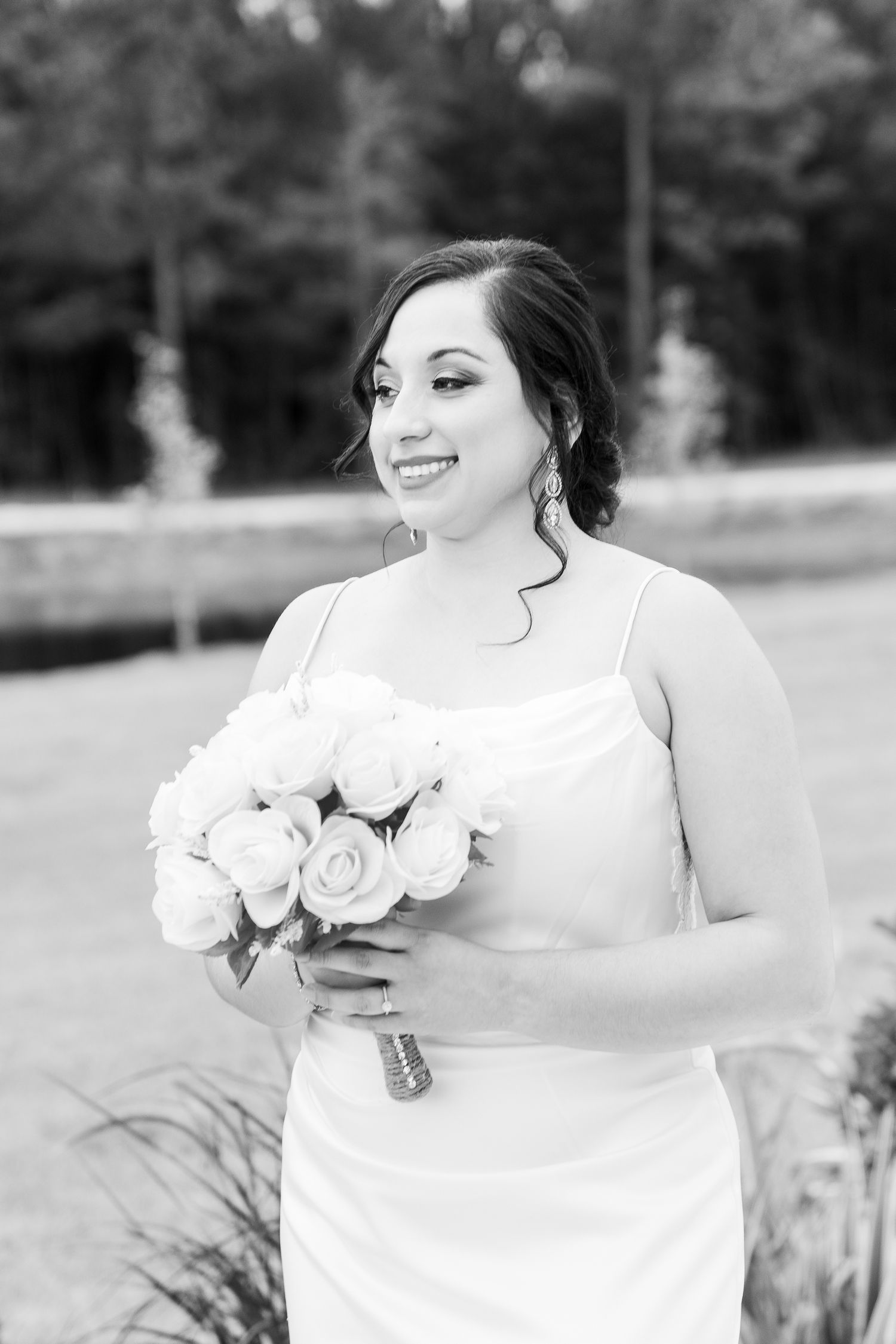 A series of black and white photos showing a bride in a white dress holding a bouquet of roses in an outdoor setting.