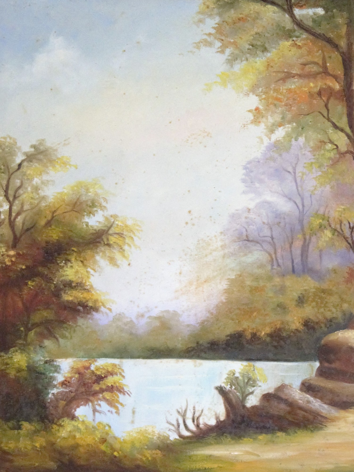 A serene landscape painting shows autumn trees and rocks along a tranquil lake with soft pastel colors in the sky.