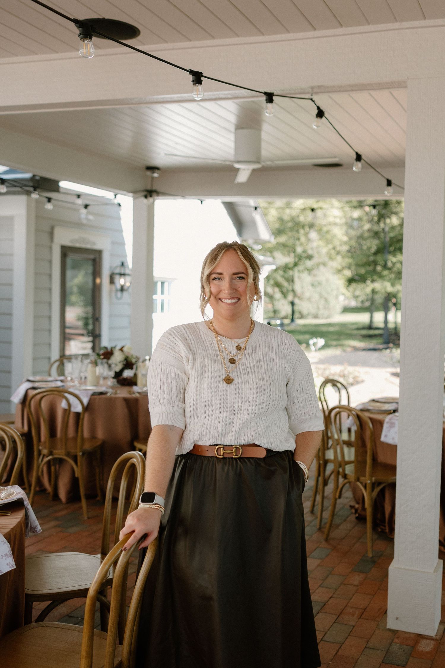 A sequence of photos showing a person in a white blouse and black skirt standing in a rustic restaurant setting.