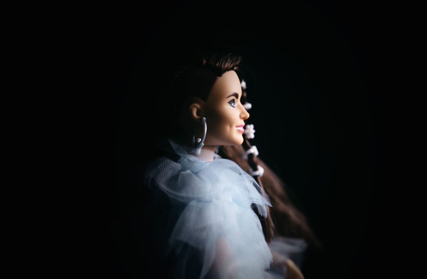Child’s favourite toy photographed in a studio with dramatic lighting, creating a bold, moody portrait with striking shadows and detail.